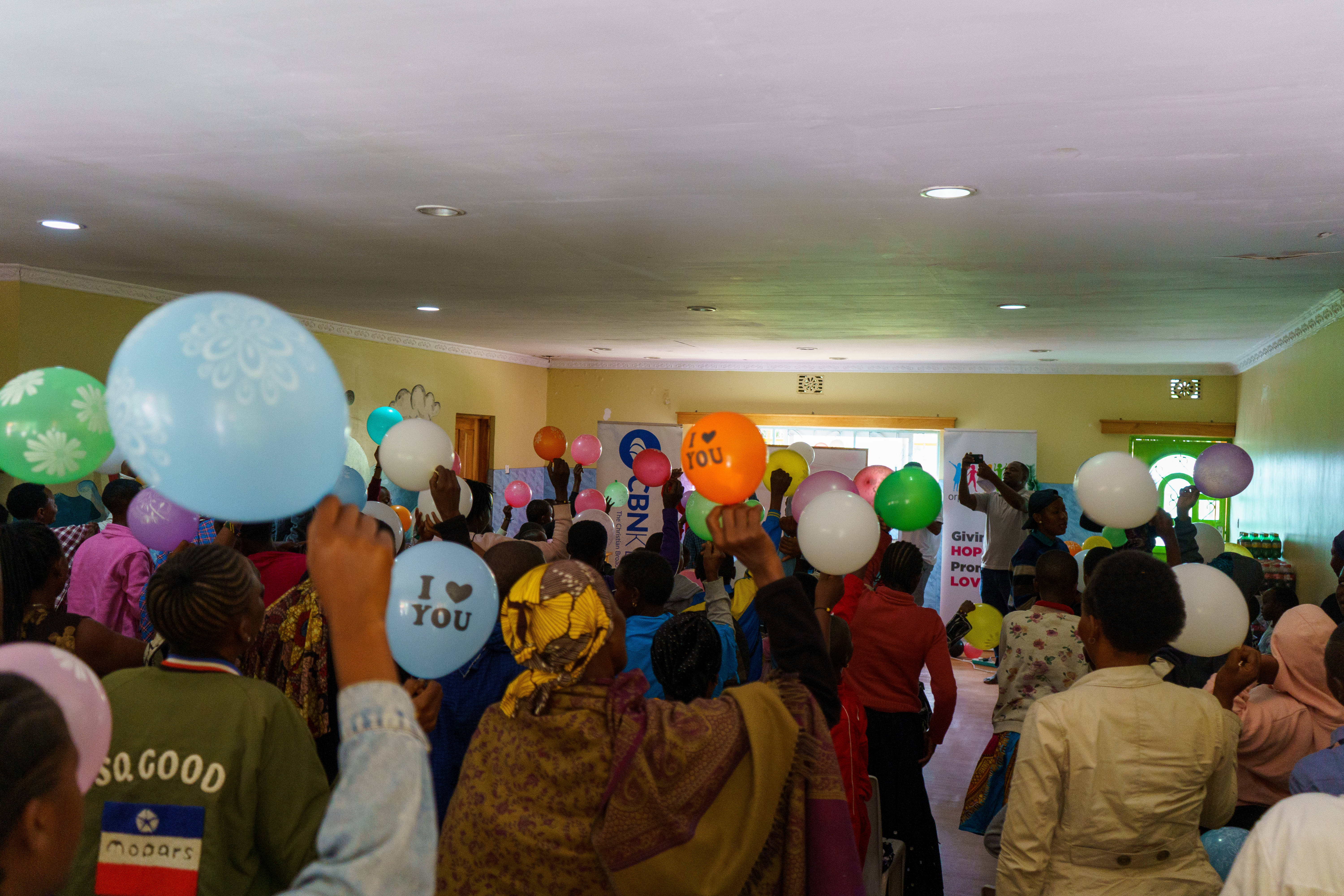 Children and parents gather at the Tumaini camp.