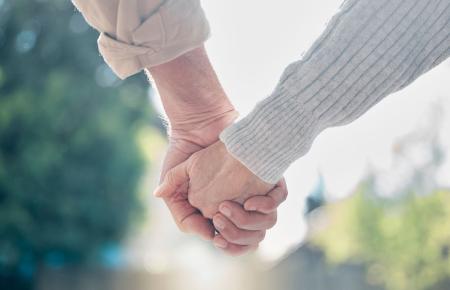 Couple holding hands