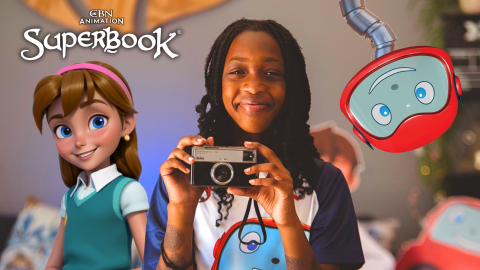 Joy, a young girl in South Africa, smiles as she holds up a camera to take a picture. Joy from Superbook is on her left and Gizmo's head hangs down from the top of frame on the right. The CBN Animation and Superbook logos are stacked above Joy from Superbook.