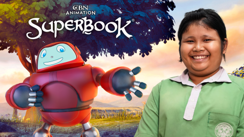 Manow, a young girl in Thailand, smiles brightly at the camera on the right side of the photo. Gizmo stands behind her to the left, smiling and reaching out toward her. The CBN Animation and Superbook logos are stacked above Gizmo.