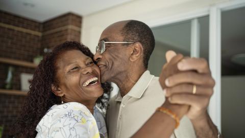 an older couple happily dancing