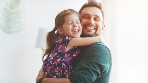 dad and daughter hug