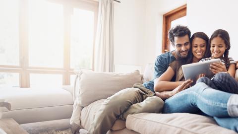 Family watching a moving together on a tablet