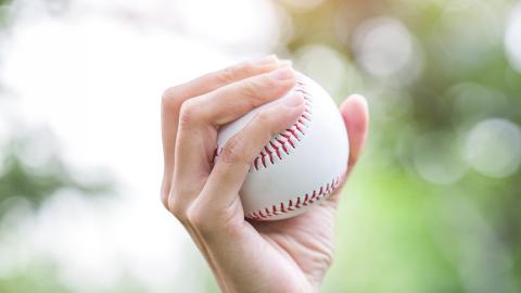 Person holding baseball
