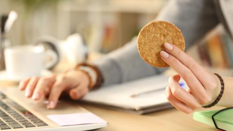 Woman holding a cookie 