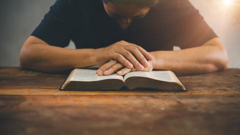 Man reading a Bible
