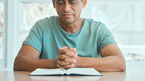 Senior man praying