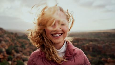 woman-smile-wind-1200.jpg