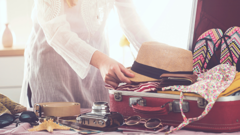 woman-packing-suitcase-1200.png