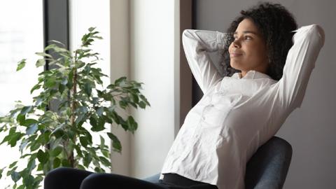 happy woman in office chair