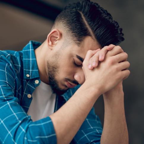 Man praying alone